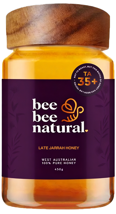 Jar of bee bee natural honey with a wooden lid and a sticker with TA 35+